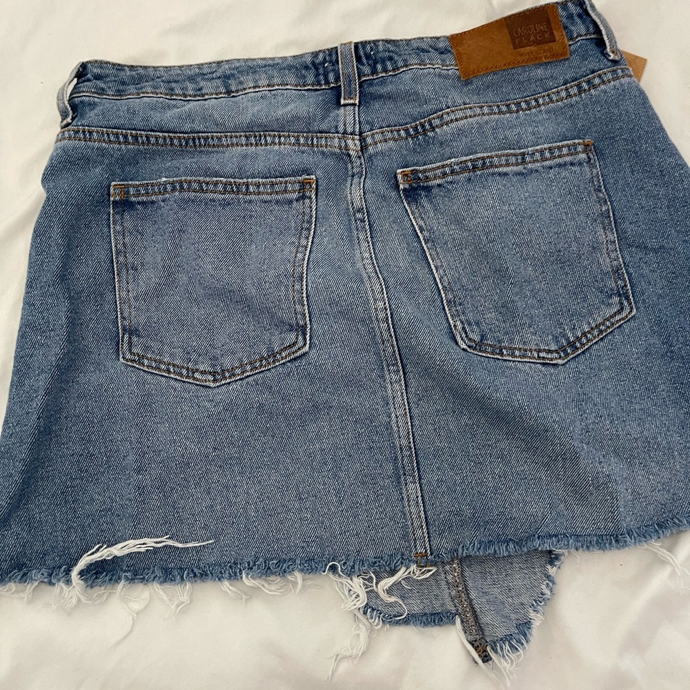 River Island asymmetrical denim skirt and distressed hem.